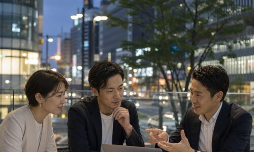 福岡 E-E-A-T強化を実践する地域企業の担当者が、地域情報や顧客の声を確認しながらウェブサイトの信頼性向上について相談している様子